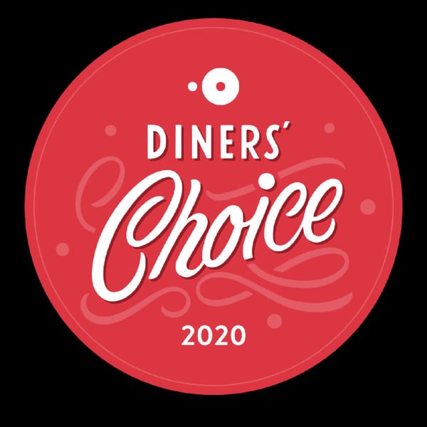 Red circular 'Diners' Choice 2020' award logo with white text and decorative swirls.