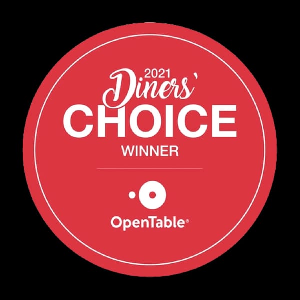 Red circular OpenTable Diners' Choice 2021 Winner badge with white text.